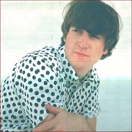 1: The Sensitive Type: Here John Lennon wears a trendy (at the time!) basic white shirt with black polka dots. This photos comes from a photo shoot that took place at John?s home in Kenwood.